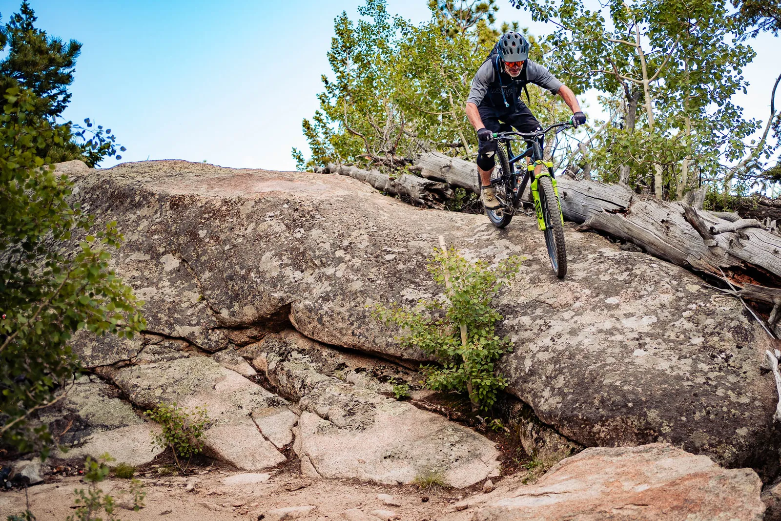 A mountain biker riding across rocks